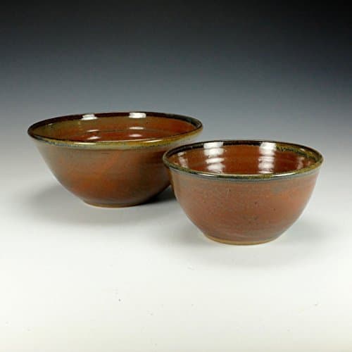 Stoneware mixing bowl set. Iron red