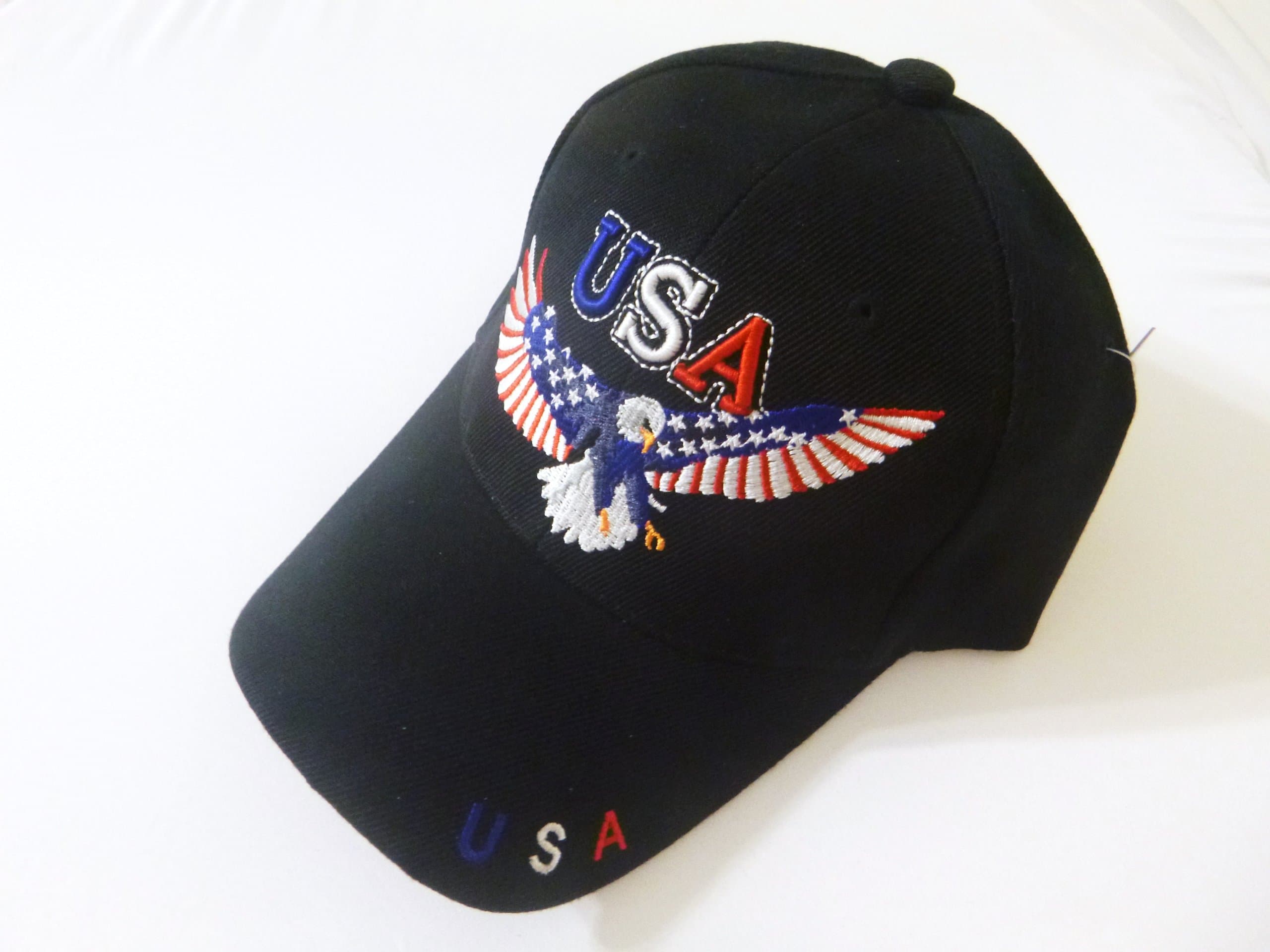 American Bald Eagle BLACK Cap FLYING BALD EAGLE with American Flag Design, USA Eagle Hat, Patriotic United States Headwear USA on the Back, Baseball Cap, Embroidered Stitching on Main Image of Eagle, Adjustable One Size Fits Most Men, Women and Older Teens