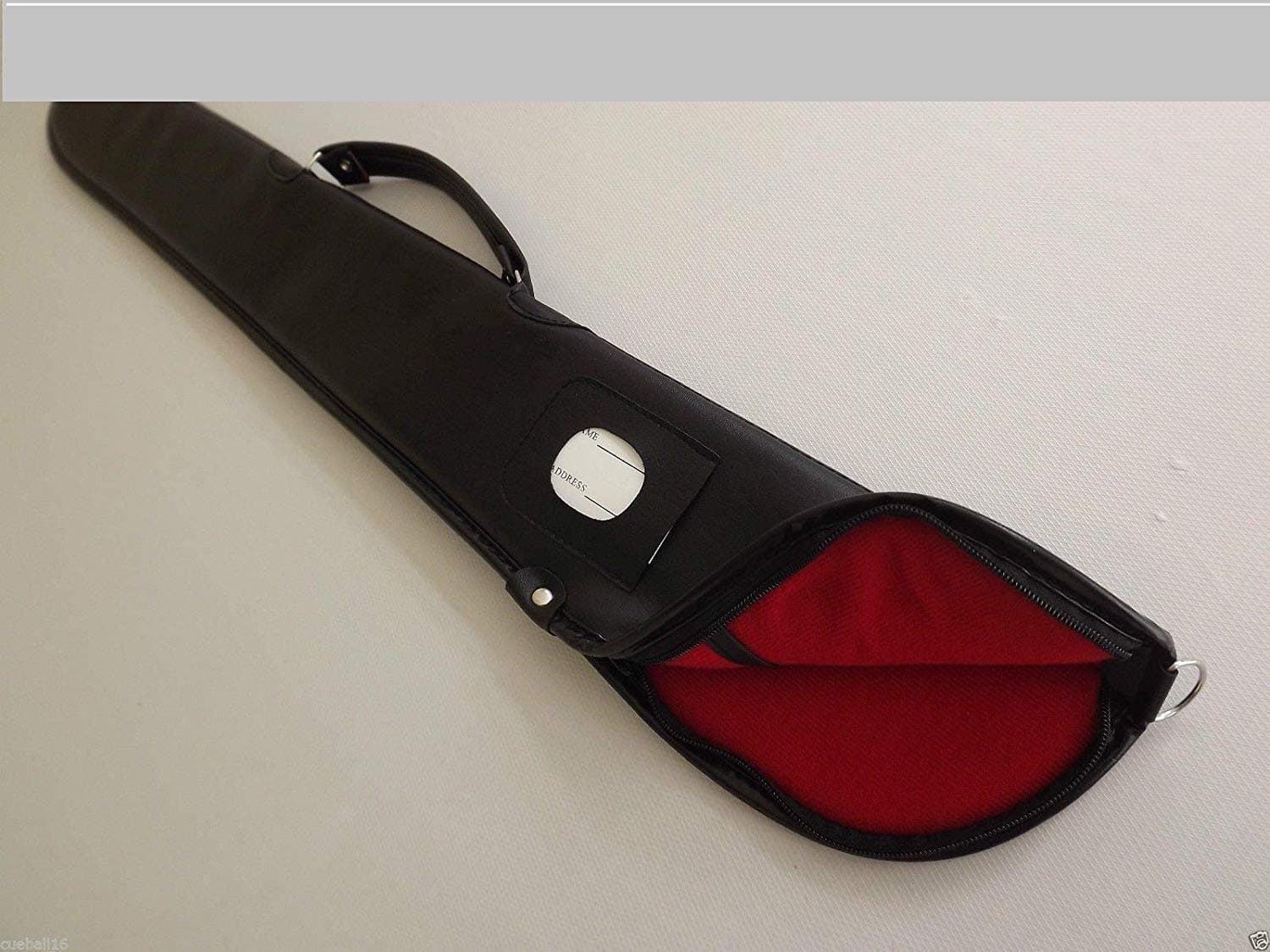 Soft black vinyl cue case with zip top and red interior